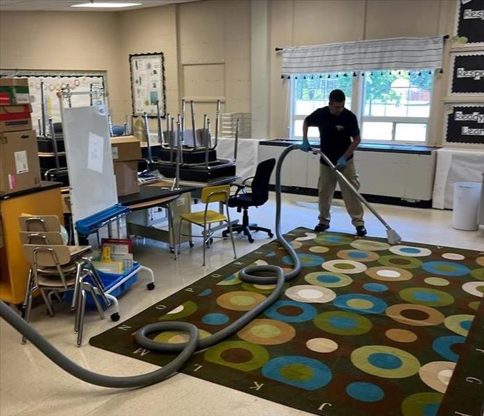 Crew cleaning classroom