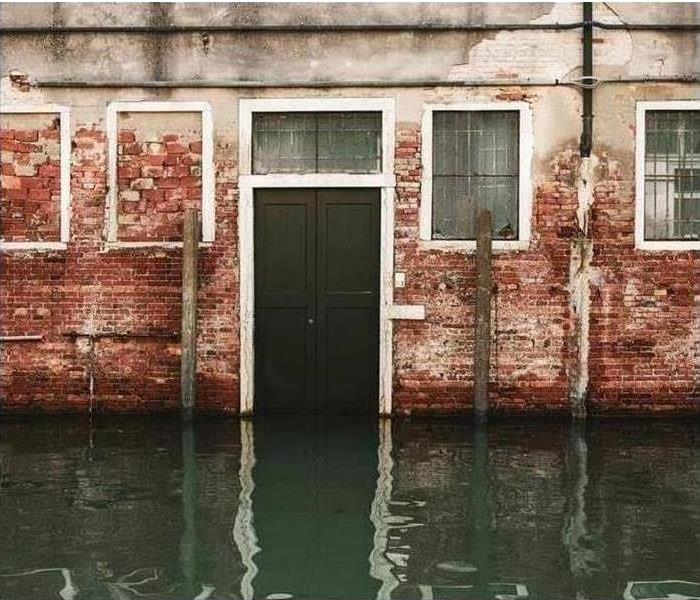 Flood water surrounding a brick structure